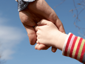 daddy and daughter holding hands