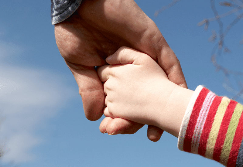 daddy and daughter holding hands