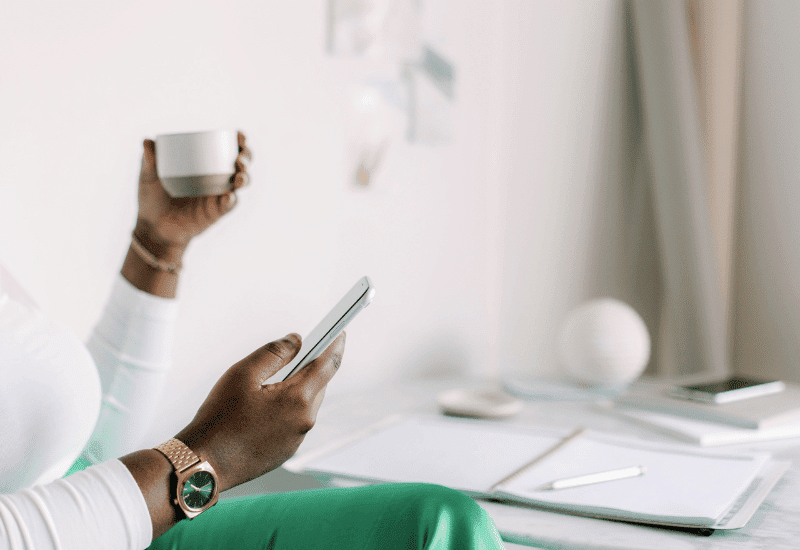 6 twitter tips for bloggers, woman checking her twitter account on her iphone