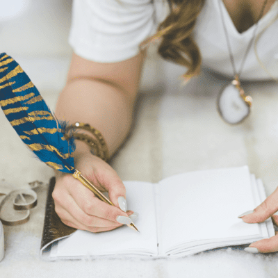 woman writing in her journal