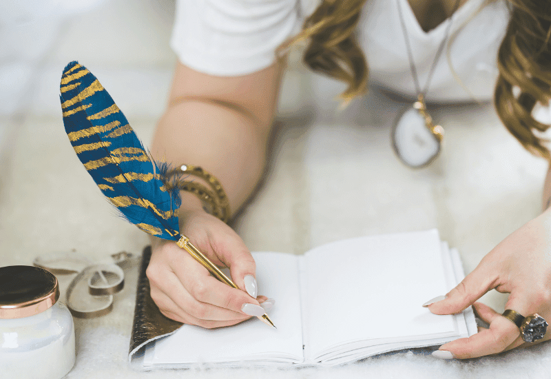 woman writing in her journal