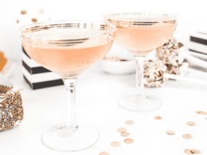 Two champagne glasses set for the Motivational Monday Series – ‘Tis the Season to Sparkle