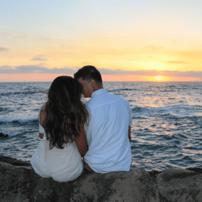 How to Have the Best Valentine’s Day on the Crystal Coast, Couple watching the sunset on the beach