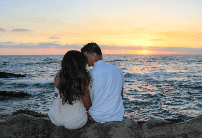 How to Have the Best Valentine’s Day on the Crystal Coast, Couple watching the sunset on the beach