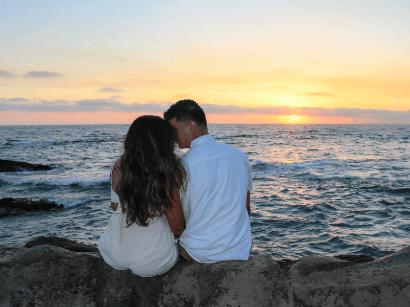 How to Have the Best Valentine’s Day on the Crystal Coast, Couple watching the sunset on the beach