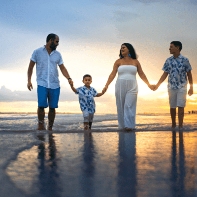 a family walks on the beach in Emerald Isle NC