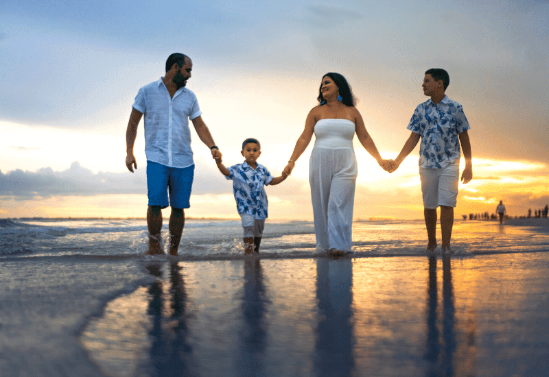 a family walks on the beach in Emerald Isle NC