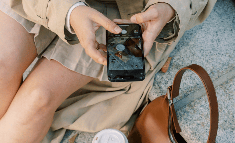 woman taking a photo to use for social media